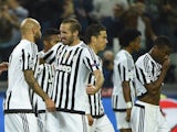 Juventus' forward from Italy Simone Zaza (L) celebrates with teammate Juventus' defender from Italy Giorgio Chiellini after scoring during the UEFA Champions League football match Juventus vs FC Sevilla on September 30, 2015