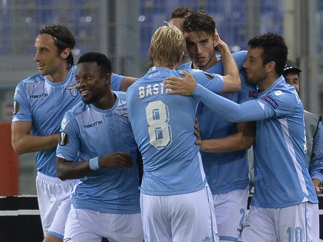 Lazio's defender from Netherlands Wesley Hoedt (C) celebrates with teammates after scoring during UEFA Europa League football match Lazio versus Saint Etienne at Rome's Olympic stadium, on October 1, 2015