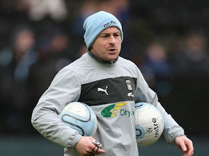 Coventry City coach Lee Carsley looks on as the players warm up prior to the npower League One match between Milton Keynes Dons and Coventry City at Stadium mk on December 29, 2012 in Milton Keynes, England.