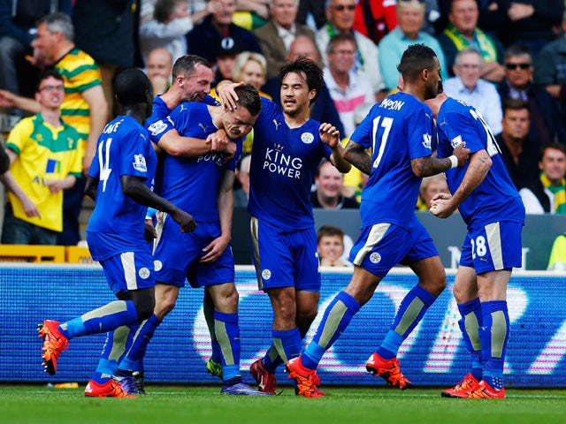 Jamie Vardy (3rd L) of Leicester City celebrates scoring his team's first goal with his team mates during the Barclays Premier League match between Norwich City and Leicester City at Carrow Road on October 3, 2015