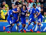 Jamie Vardy (3rd L) of Leicester City celebrates scoring his team's first goal with his team mates during the Barclays Premier League match between Norwich City and Leicester City at Carrow Road on October 3, 2015