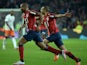 Lille's French defender Djibril Sidibe (L) celebrates with Lille's Moroccan midfielder Mounir Obbadi (R) during the French L1 football match between Lille and Montpellier on October 2, 2015 at the Pierre Mauroy stadium in Villeneuve d'Ascq, northern Franc