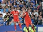 Liverpool's English striker Danny Ings (L) celebrates with Liverpool's Slovakian defender Martin Skrtel after scoring the opening goal during the English Premier League football match between Everton and Liverpool at Goodison Park in Liverpool north west 