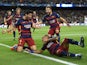 Barcelona's Uruguayan forward Luis Suarez celebrates a goal with his teammates during the UEFA Champions League football match FC Barcelona vs Bayer Leverkusen at the Camp Nou stadium in Barcelona on September 29, 2015.