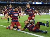 Barcelona's Uruguayan forward Luis Suarez celebrates a goal with his teammates during the UEFA Champions League football match FC Barcelona vs Bayer Leverkusen at the Camp Nou stadium in Barcelona on September 29, 2015.