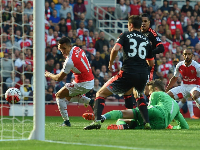 Alexis Sanchez of Arsenal scores Arsenal's first goal during the Barclays Premier League match between Arsenal and Manchester United at Emirates Stadium on October 4, 2015 in London, England.