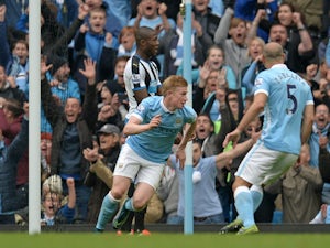 Manchester City's Belgian midfielder Kevin De Bruyne celebrates after scoring their fourth goal during the English Premier League football match between Manchester City and Newcastle United at The Etihad Stadium in Manchester, north west England on Octobe