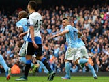 Sergio Aguero of Manchester City celebrates scoring his team's first goal with his team mates during the Barclays Premier League match between Manchester City and Newcastle United at Etihad Stadium on October 3, 2015