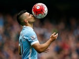 Sergio Aguero of Manchester City kisses the ball to celebrate a goal during the Barclays Premier League match between Manchester City and Newcastle United at Etihad Stadium on October 3, 2015