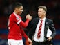 Louis van Gaal manager of Manchester United celebrates victory with winning goalscorer Chris Smalling in the UEFA Champions League Group B match between Manchester United FC and VfL Wolfsburg at Old Trafford on September 30, 2015