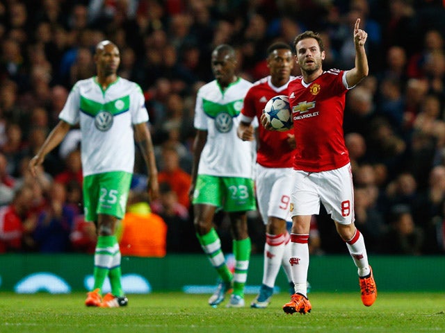 Juan Mata of Manchester United (8) celebrates as he scores their first and equalising goal from the penalty spot during the UEFA Champions League Group B match between Manchester United FC and VfL Wolfsburg at Old Trafford on September 30, 2015