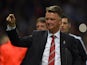 Manchester United's Dutch coach Louis van Gaal gestures as he arrives on the pitch ahaed of the UEFA Champions League Group B football match between Manchester United and VfL Wolfsburg at Old Trafford in Manchester, north west England, on September 30, 20