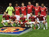 Manchester United's English forward Wayne Rooney (front row C) poses with teammates ahead of the UEFA Champions League Group B football match between Manchester United and VfL Wolfsburg at Old Trafford in Manchester, north west England, on September 30, 2