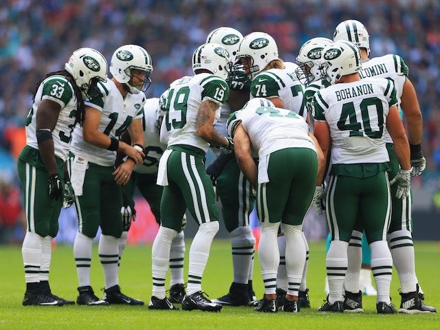 New York Jets players huddle during the game against Miami Dolphins at Wembley on October 4, 2015