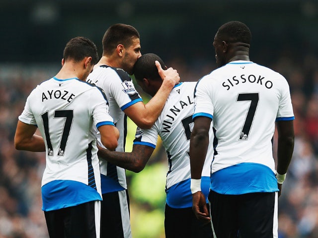 Aleksandar Mitrovic (2nd L) of Newcastle United celebrates scoring his team's first goal with his team mates during the Barclays Premier League match between Manchester City and Newcastle United at Etihad Stadium on October 3, 2015