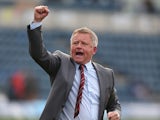 Northampton Town manager Chris Wilder celebrates victory at the final whistle during the Sky Bet League Two match between Wycombe Wanderers and Northampton Town at Adams Park on October 3, 2015 