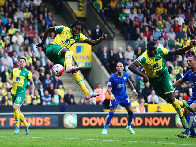 Dieumerci Mbokani of Norwich City scores his team's first goal during the Barclays Premier League match between Norwich City and Leicester City at Carrow Road on October 3, 2015