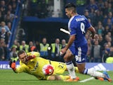 Chelsea's Colombian striker Radamel Falcao (R) is brought down in the area by Southampton's Dutch goalkeeper Maarten Stekelenburg during the English Premier League football match between Chelsea and Southampton at Stamford Bridge in London on October 3, 2