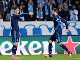 Real Madrid's Portuguese forward Cristiano Ronaldo celebrates after scoring the opening goal with his teammate Spanish defender Nacho (R) during the UEFA Champions League first-leg Group A football match between Malmo FF and Real Madrid CF at the Swedbank