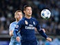 Real Madrid's Portuguese forward Cristiano Ronaldo (R) and Malmo's Norwegian midfielder Jo Inge Berget vie for the ball during the UEFA Champions League first-leg Group A football match between Malmo FF and Real Madrid CF at the Swedbank Stadion, in Malmo