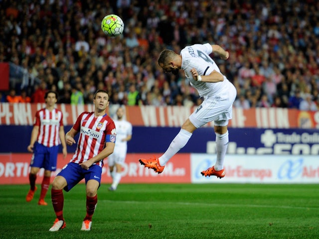 Karim Benzema of Real Madrid scores Real's opening goal during the La Liga match between Club Atletico de Madrid and Real Madrid at Vicente Calderon Stadium on October 4, 2015