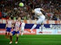 Karim Benzema of Real Madrid scores Real's opening goal during the La Liga match between Club Atletico de Madrid and Real Madrid at Vicente Calderon Stadium on October 4, 2015