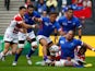 Alesana Tuilagi of Samoa is tackled during the 2015 Rugby World Cup Pool B match between Samoa and Japan at Stadium mk on October 3, 2015