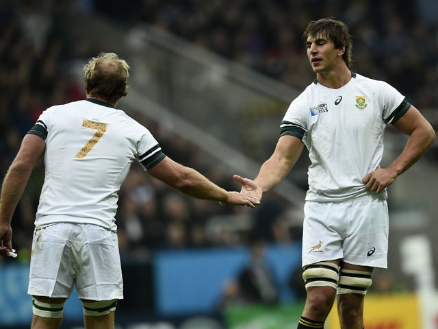 South Africa's flanker Schalk Burger (L) celebrates after scoring a try with South Africa's lock Eben Etzebeth during a Pool B match of the 2015 Rugby World Cup between South Africa and Scotland at St James' Park in Newcastle-upon-Tyne, north east England