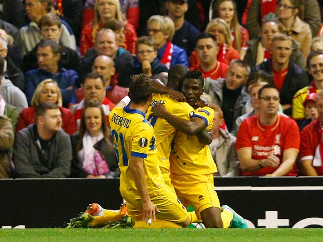 Ebenezer Assifuah of FC Sion celebrates scoring their first goal with team mates during the UEFA Europa League group B match between Liverpool FC and FC Sion at Anfield on October 1, 2015