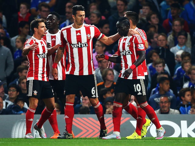 Sadio Mane of Southampton celebrates scoring his team's second goal with his team mates during the Barclays Premier League match between Chelsea and Southampton at Stamford Bridge on October 3, 2015 in London, United Kingdom.