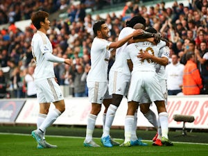Harry Kane own goal puts Swansea in front
