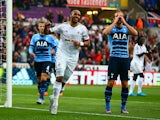 Ashley Williams of Swansea City celebrates after Harry Kane of Tottenham Hotspur scores an own goal during the Barclays Premier League match between Swansea City and Tottenham Hotspur at Emirates Stadium on October 4, 2015 in Swansea, Wales.