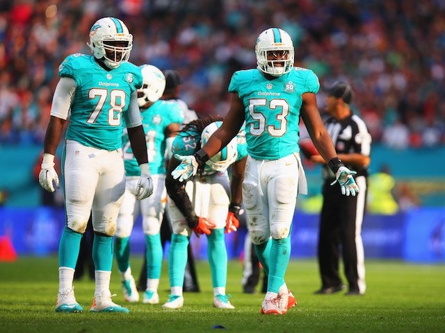 Miami Dolphins players Terrence Fede and Jelani Jenkins react during the game with New York Jets at Wembley on October 4, 2015