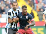 Danilo Larangeira of Udinese Calcio competes with Serge Gakpe of Genoa CFC during the Serie A match between Udinese Calcio and Genoa CFC at Stadio Friuli on October 4, 2015 in Udine, Italy.