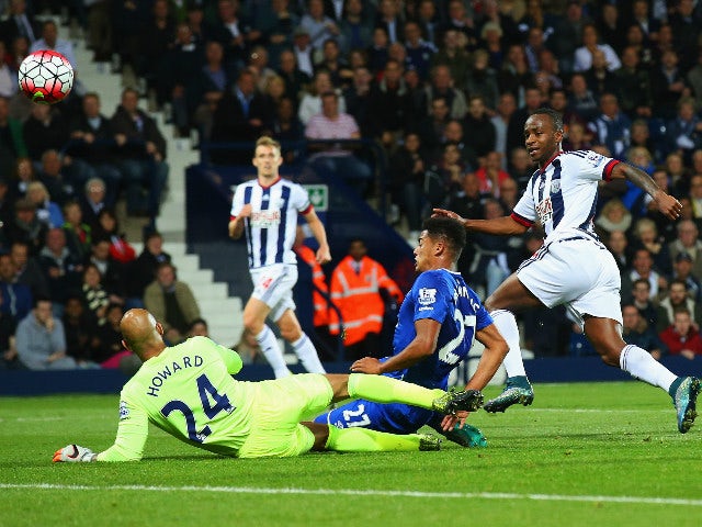 Saido Berahino of West Bromwich Albion beats goalkeeper Tim Howard and Tyias Browning of Everton to score their first goal during the Barclays Premier League match between West Bromwich Albion and Everton on September 28, 2015 in West Bromwich, United Kin