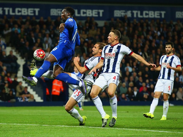 Romelu Lukaku of Everton beats Craig Dawson (25) and James Chester of West Bromwich Albion (4) as he scores their third goal during the Barclays Premier League match between West Bromwich Albion and Everton at The Hawthorns on September 28, 2015 in West B