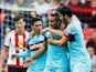 Dimitri Payet (2nd R) of West Ham United celebrates scoring his team's second goal with his team mates during the Barclays Premier League match between Sunderland and West Ham United at the Stadium of Light in Sunderland on October 3, 2015