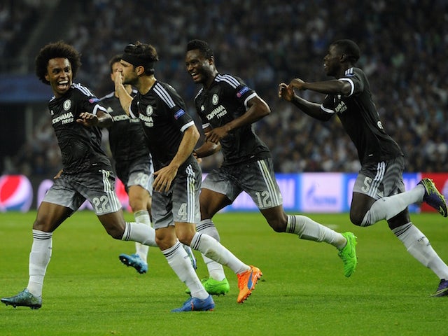 Chelsea's Brazilian midfielder Willian (L) celebrates a goal with teammates during the UEFA Champions League Group G football match at the Dragao stadium in Porto on September 29, 2015.