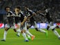 Chelsea's Brazilian midfielder Willian (L) celebrates a goal with teammates during the UEFA Champions League Group G football match at the Dragao stadium in Porto on September 29, 2015.