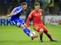 Aaron Ramsey (R) of Wales in action against Anel Hadzic (L) of Bosnia during the Euro 2016 qualifying football match between Bosnia and Herzegovina and Wales at the Stadium Bilino Polje in Elbasan on October 10, 2015.