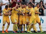 Mariners team mates celebrate a goal with team mates during the round one A-League match between the Central Coast Mariners and the Perth Glory at Central Coast Stadium on October 10, 2015