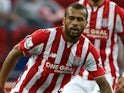 Phil Jagielka of Everton is challenged by Dionatan Teixeira of Stoke City during the Barclays Asia Trophy match between Everton and Stoke City at National Stadium on July 15, 2015 in Singapore.