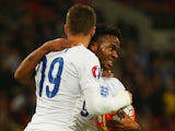Raheem Sterling of England (R) celebrates with Jamie Vardy as he scores their second goal during the UEFA EURO 2016 Group E qualifying match between England and Estonia at Wembley on October 9, 2015 in London, United Kingdom.