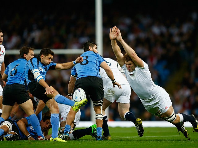 Joe Launchbury of England attempts to block Agustin Ormaechea of Uruguay during the 2015 Rugby World Cup Pool A match between England and Uruguay at Manchester City Stadium on October 10, 2015 in Manchester, United Kingdom.