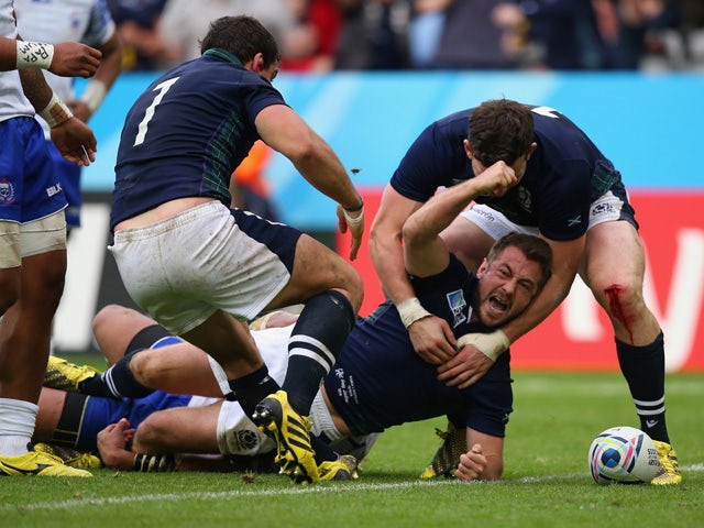 Greig Laidlaw of Scotland scores the third try during the 2015 Rugby World Cup Pool B match between Samoa and Scotland at St James' Park on October 10, 2015