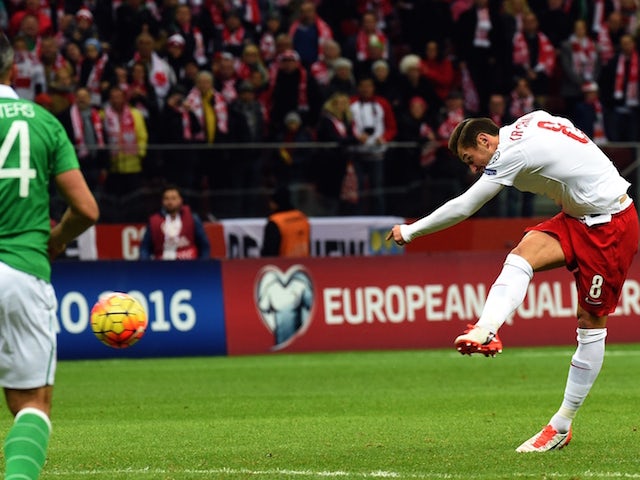 Poland's midfielder Grzegorz Krychowiak scores a goal during the Euro 2016 Group D qualifying football match between Poland and the Republic of Ireland at the Stadion Narodowy in Warsaw on October 11, 2015.
