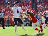 Jay Cutler (6) of the Chicago Bears throws the ball avoiding the attempted sack of Justin Houston (50) of the Kansas City Chiefs at Arrowhead Stadium during the game on October 11, 2015 in Kansas City, Missouri. 