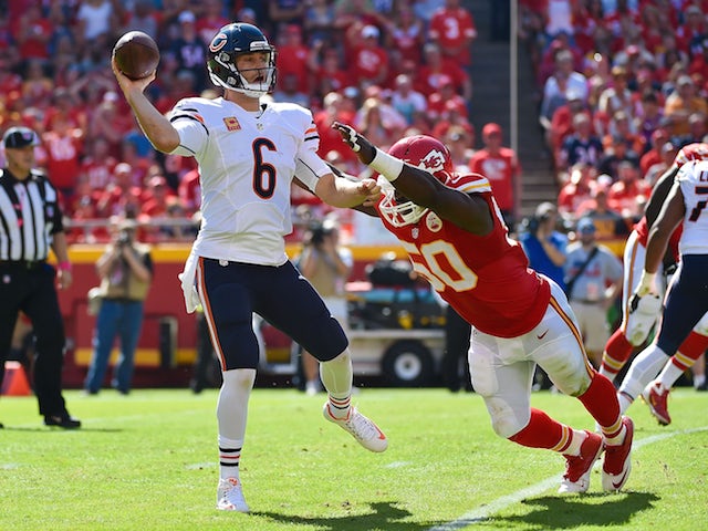 Jay Cutler (6) of the Chicago Bears throws the ball avoiding the attempted sack of Justin Houston (50) of the Kansas City Chiefs at Arrowhead Stadium during the game on October 11, 2015 in Kansas City, Missouri. 