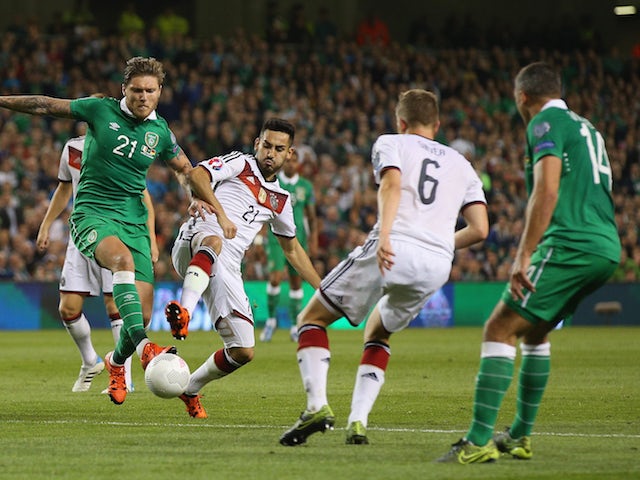 Jeff Hendrick of Republic of Ireland and Ilkay Gundogan of Germany compete for the ball during the UEFA EURO 2016 Qualifier group D match between Republic of Ireland and Germany at the Aviva Stadium on October 8, 2015 in Dublin, Ireland.