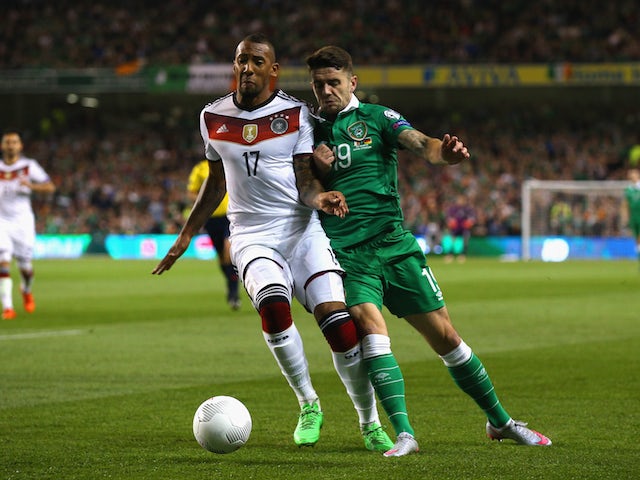 Jerome Boateng of Germany and Robbie Brady of Republic of Ireland battle for the ball during the UEFA EURO 2016 Qualifier group D match between Republic of Ireland and Germany at the Aviva Stadium on October 8, 2015 in Dublin, Ireland. 